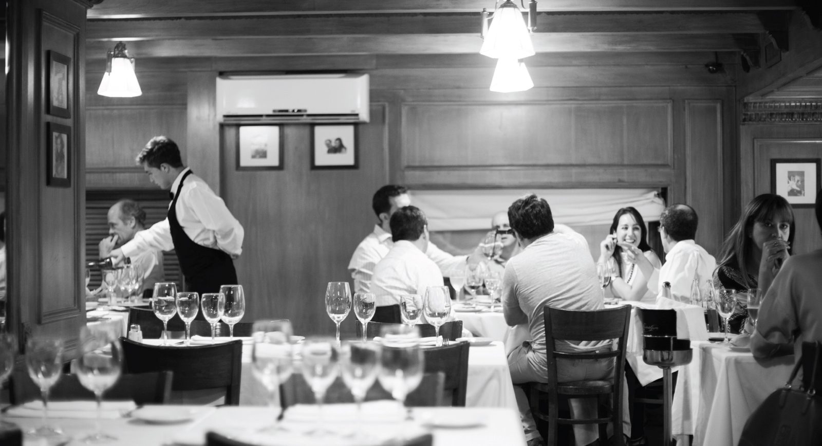 Guests dining at Sottovoce in the evening